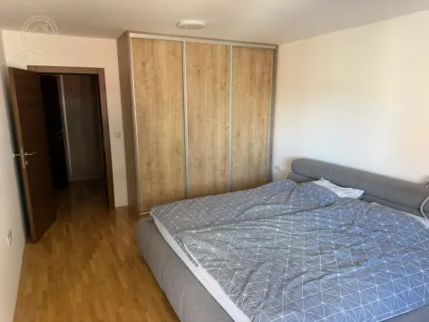 Bedroom with a large double bed and a fitted wardrobe. - image 4