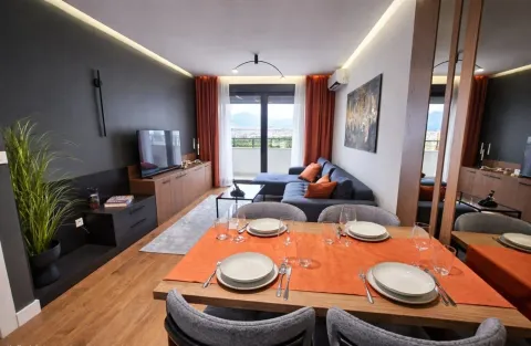 Living room with dining area and access to the terrace. - image 5