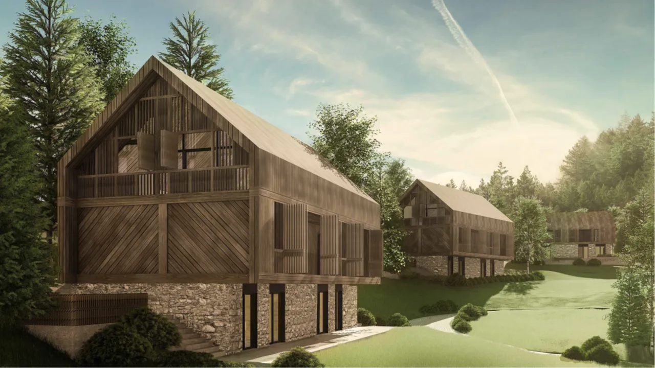 Spoljašnji izgled modernih drvenih vikendica u šumskom okruženju.