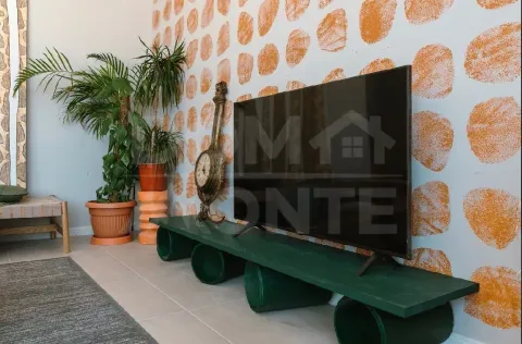 Living room with a TV and decorative elements. - image 17