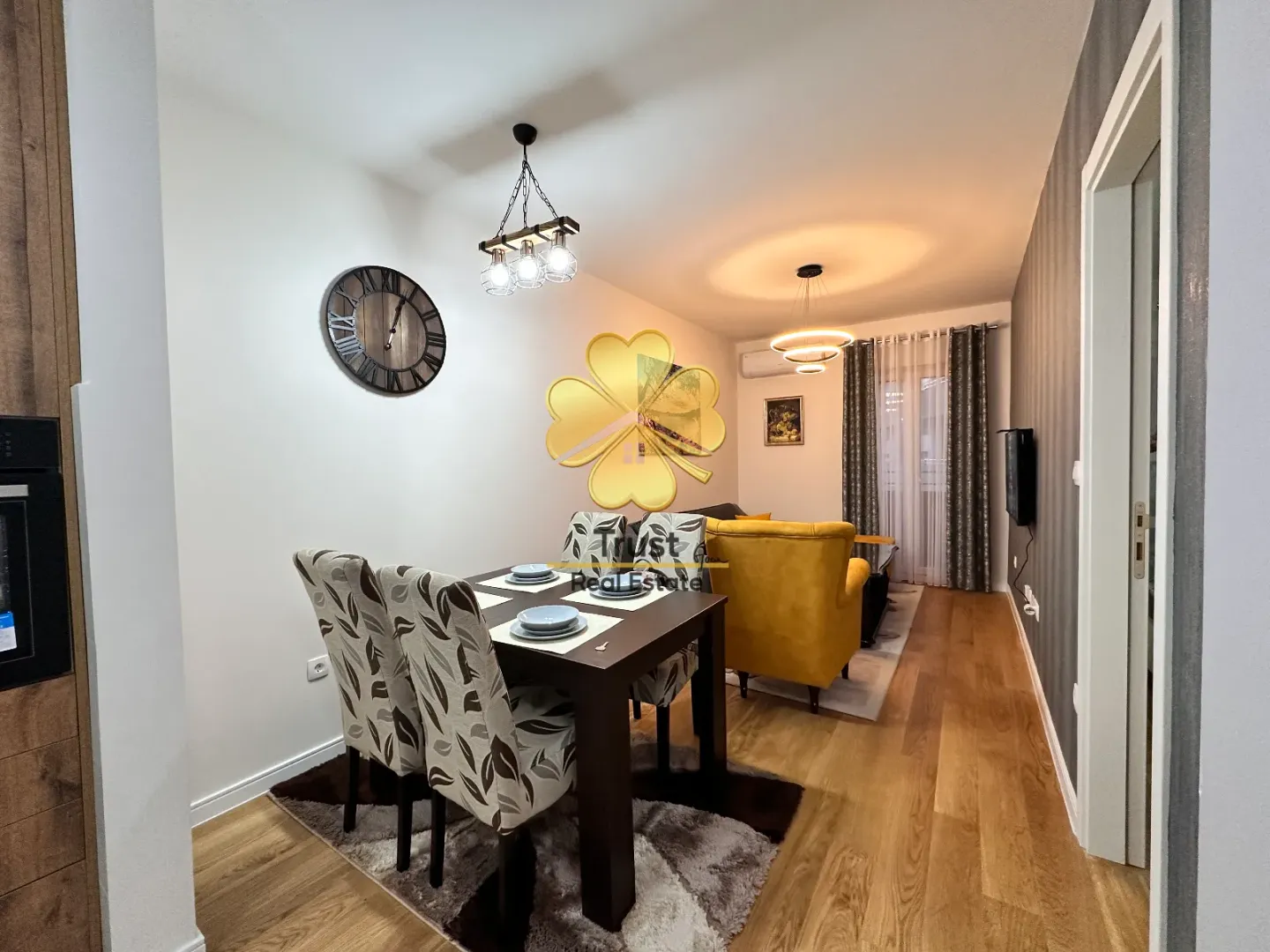 Living room with a dining area and modern furniture.