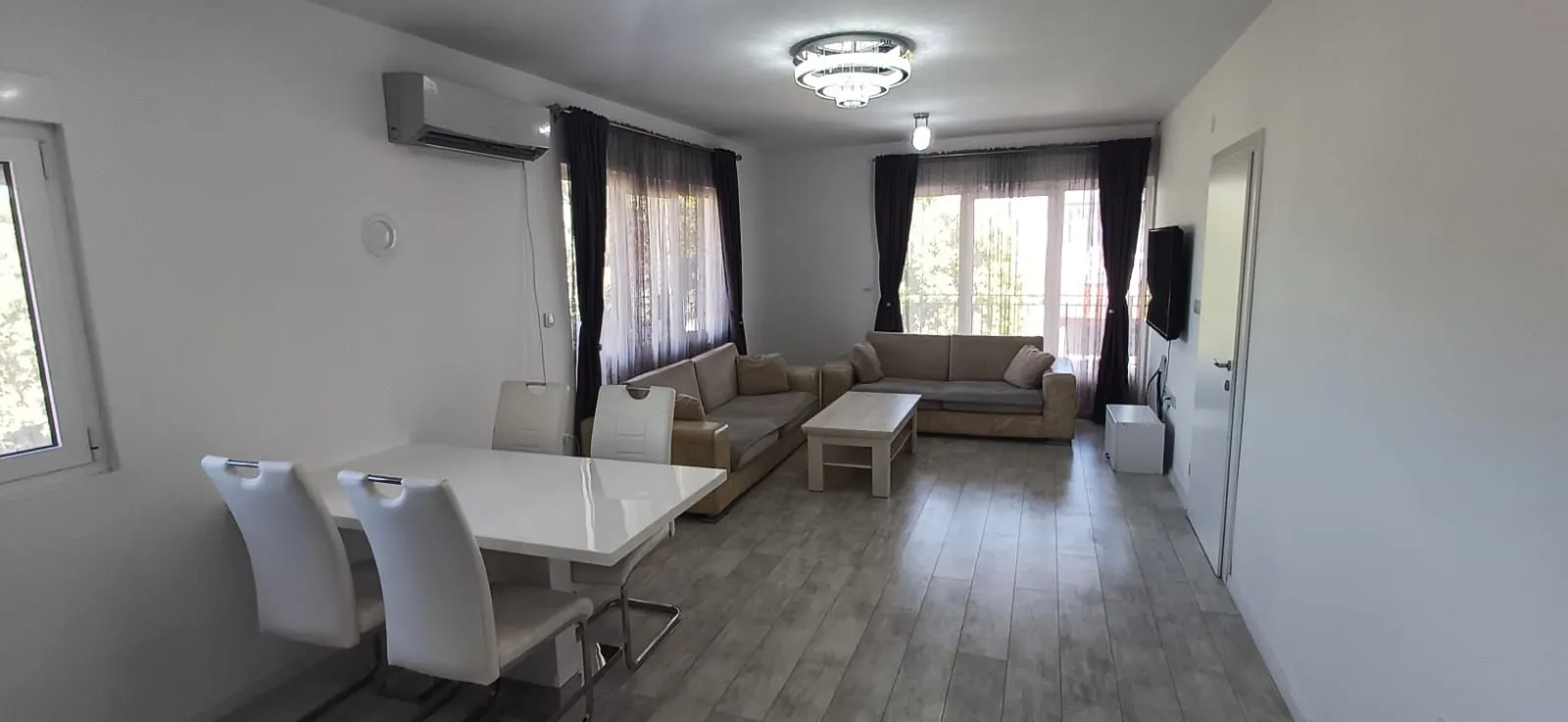 Spacious living room with a dining area and seating furniture.