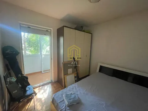 Bedroom with a double bed, wardrobe, and access to the terrace. - image 5