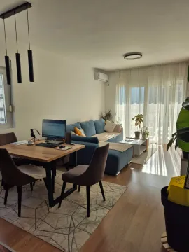 Living room with dining area and sofa set. - image 15