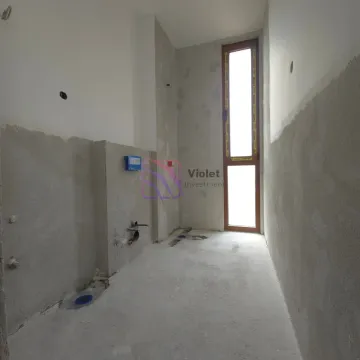 Unfinished room under construction with installations and a door. - image 8