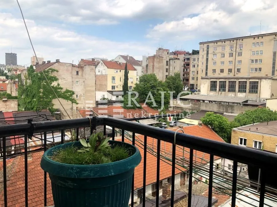 View from the balcony overlooking the urban area with buildings.