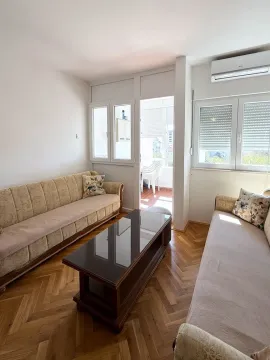 Living room with a sofa set and access to the terrace. - image 9