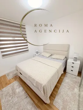 Furnished bedroom with a double bed and bedside tables. - image 5