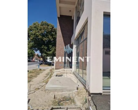 View of the exterior of the building with the entrance and large glass surfaces. - image 14