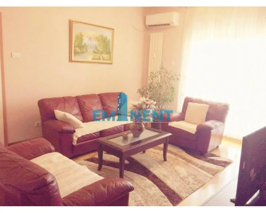 Living room with leather sofas and a coffee table.