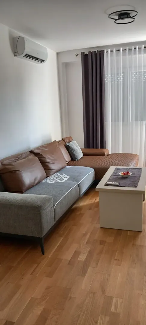 Bright living room with a sectional sofa and coffee table.