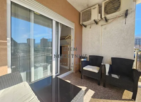 Furnished balcony with seating set and air conditioning units. - image 14