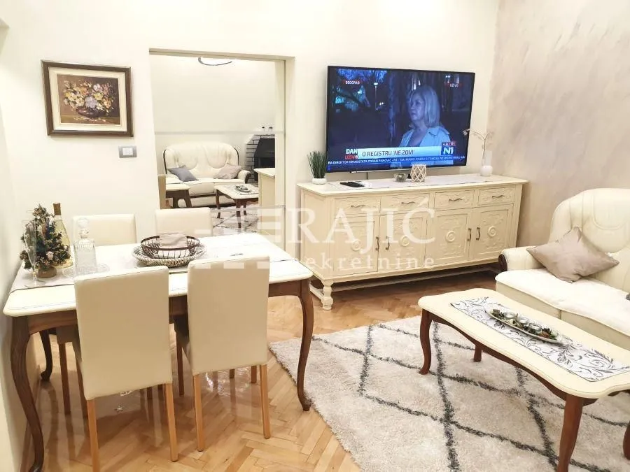 Spacious living room with a dining area and seating set.