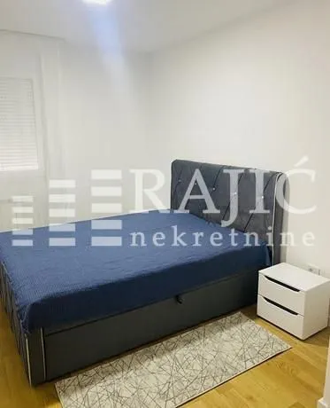 Furnished bedroom with a double bed.