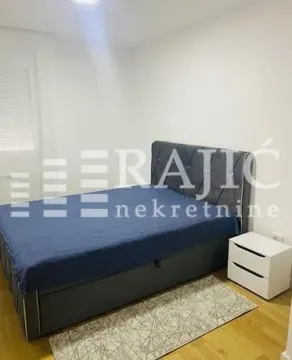Furnished bedroom with a double bed. - image 3