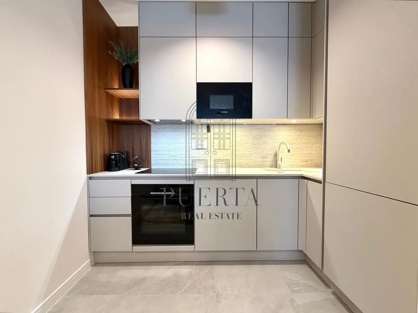 Modern kitchen with built-in units and appliances.