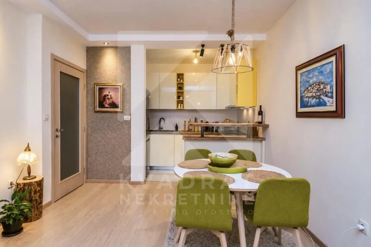 Kitchen with a dining area and modern interior elements.