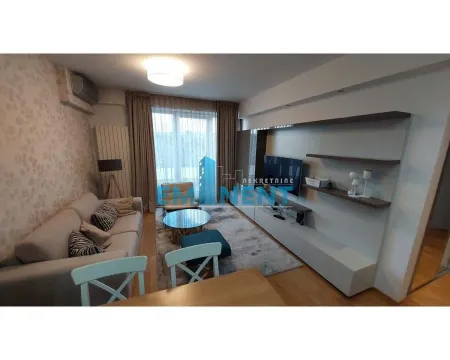 Living room with a sofa, TV unit and dining table. - image 2
