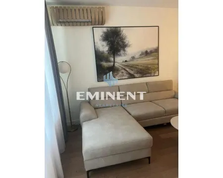 Corner sofa in the living room with an artwork on the wall. - image 3