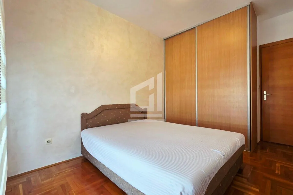 Bedroom with a double bed and a fitted wardrobe.