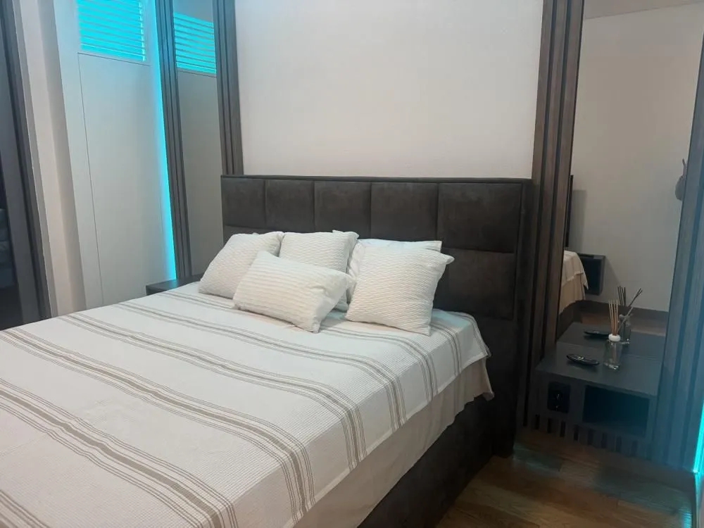 Modern bedroom with a double bed and bedside tables.
