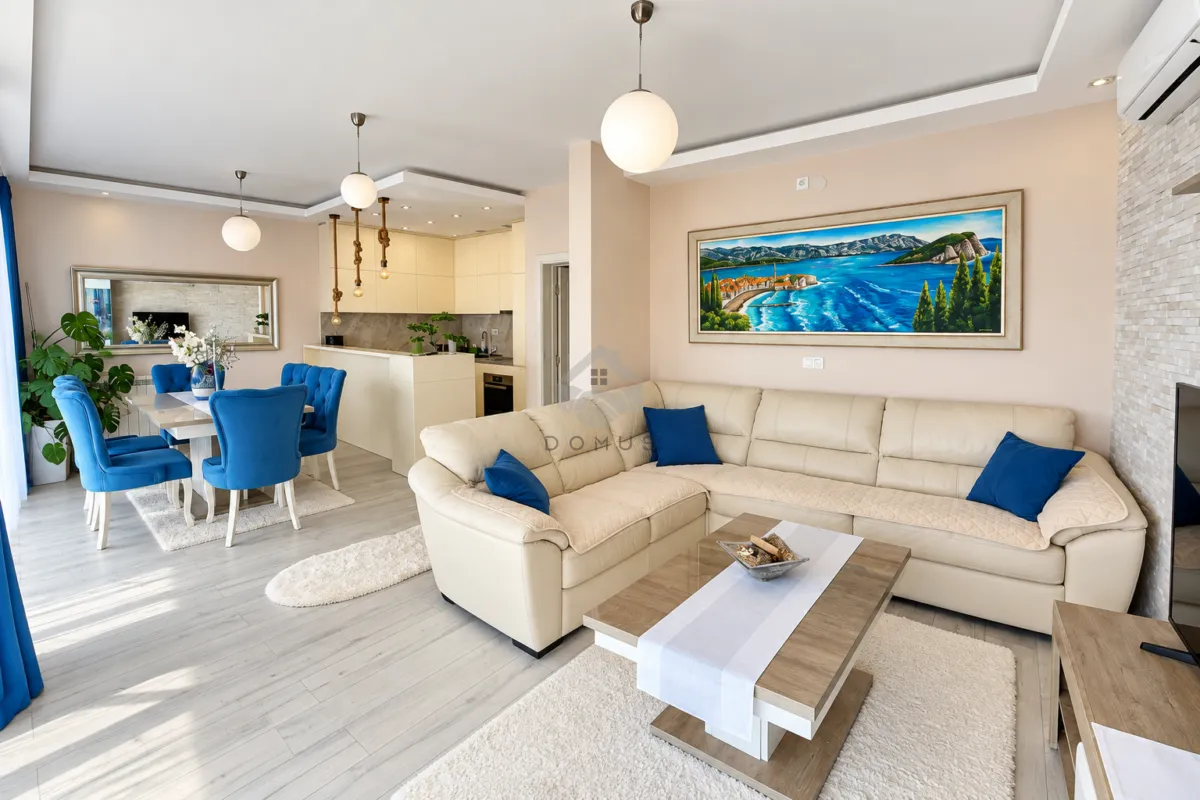 Spacious living room connected with the dining area and kitchen.