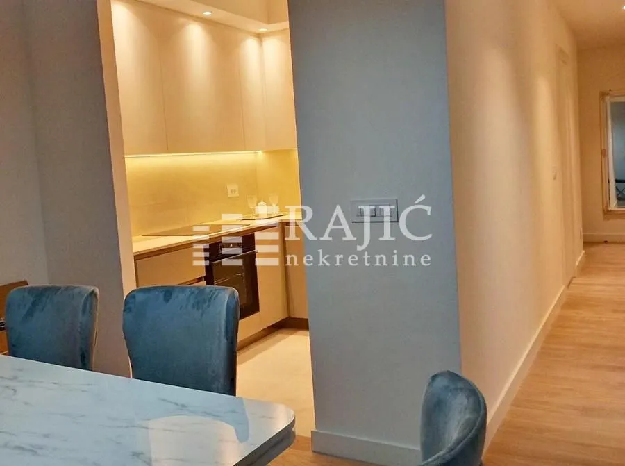 View from the dining area towards the kitchen with built-in units.