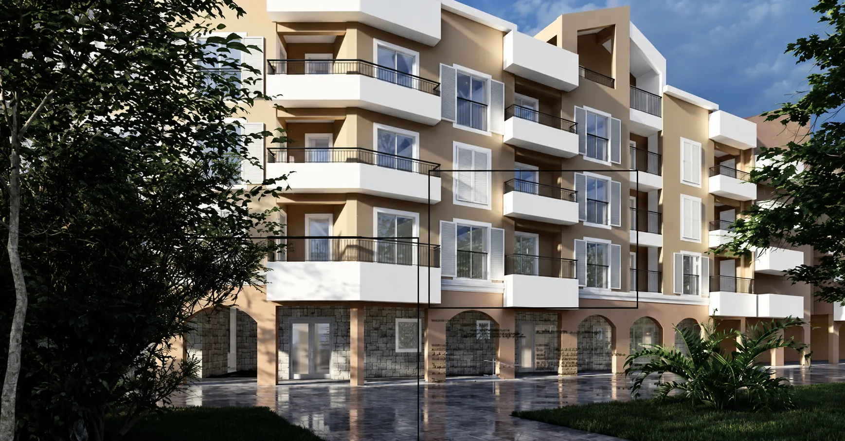 Exterior view of a modern residential building with balconies and a landscaped ground floor.
