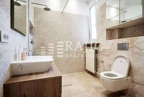 Modernly equipped bathroom with a walk-in shower and washbasin. - image 15