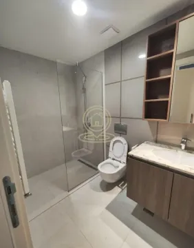 Modernly equipped bathroom with a walk-in shower and a vanity with a sink. - image 10