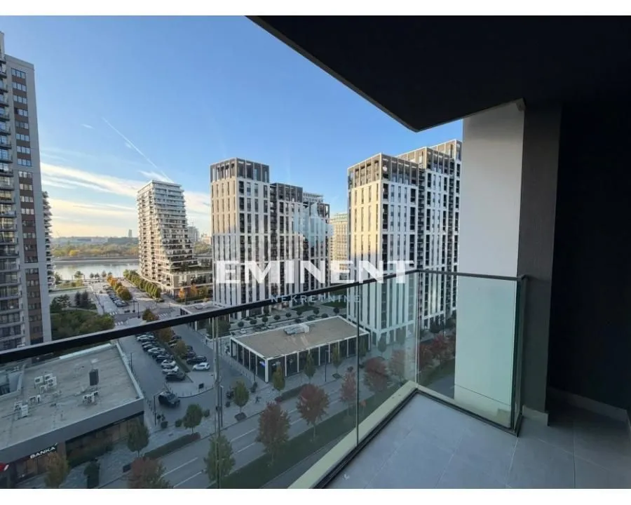 View from the balcony overlooking surrounding residential buildings and the street.