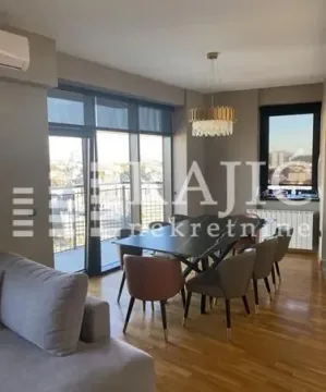 Spacious living room with a dining area and access to the terrace. - image 2