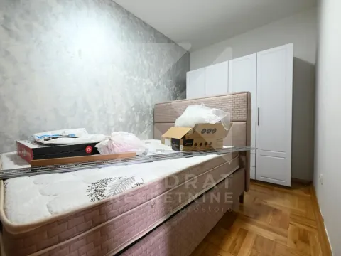 Furnished bedroom with a double bed and wardrobe. - image 8