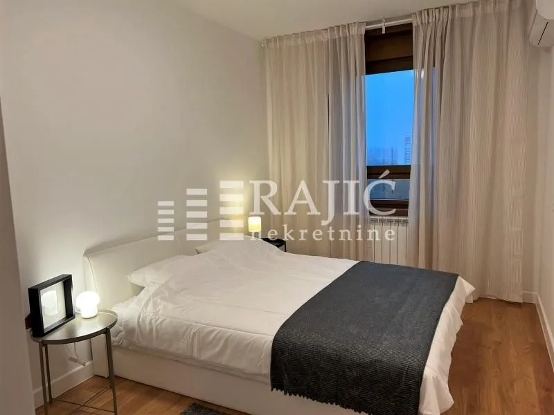 Bright bedroom with a double bed.