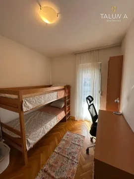 Children's bedroom with a bunk bed, desk, and access to the terrace. - image 7