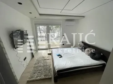 Modern bedroom with a double bed and access to the terrace. - image 10