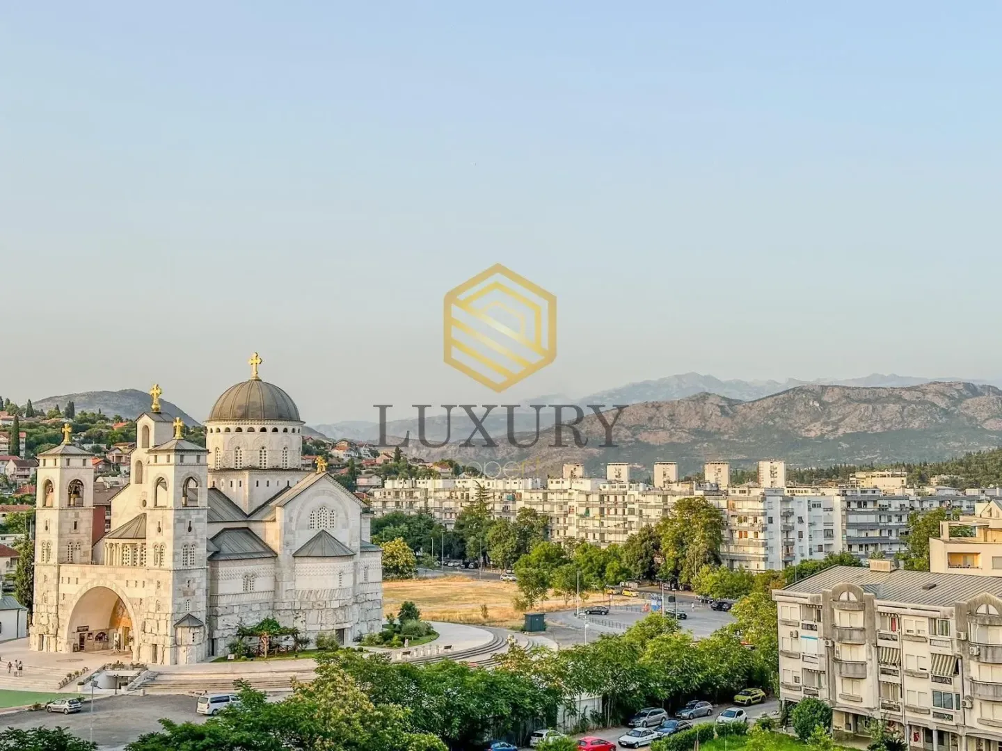 View from the terrace overlooking the temple and cityscape.