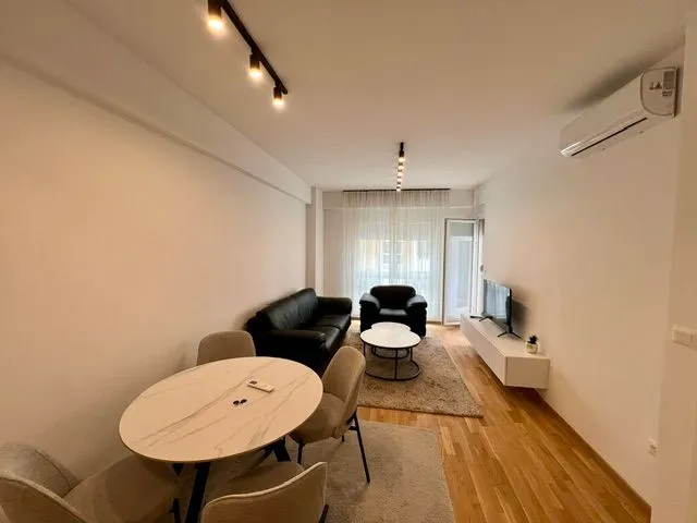 Living room with dining area and furniture.
