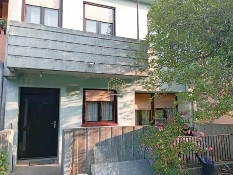 View of the exterior of the house with an entrance door and a balcony on the upper floor. - image 5