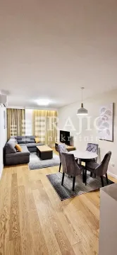 Spacious living room with dining area and sofa. - image 4