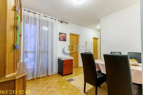 Living room with dining area and parquet flooring. - image 22