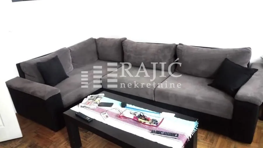 Living room with a sectional sofa and coffee table.