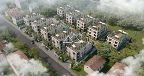 Pogled iz vazduha na kompleks modernih zgrada sa uređenim dvorištem. - image 8