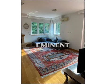 Living room with a sofa set and a large rug on the floor. - image 2