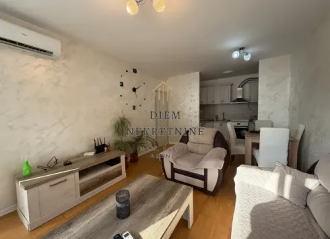 Living room with furniture, TV unit, and dining area in the background. - image 3
