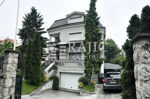 Front exterior of a multi-family house with a courtyard and garage. - image 6