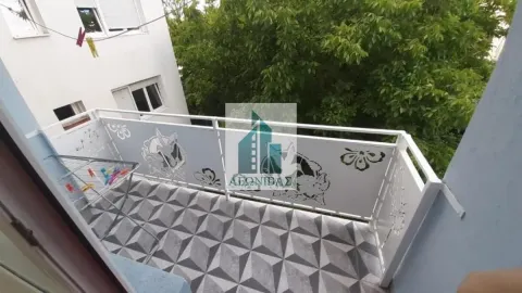 View of a spacious balcony with a metal railing and decorative tiles. - image 6