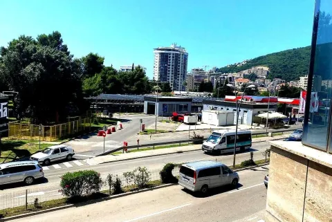 View from the terrace overlooking a city street and buildings. - image 2