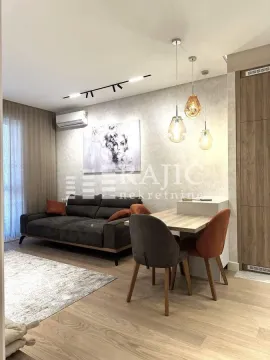 Living room with dining area and modern furniture. - image 3