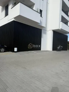 View of the exterior of the building with parking space and entrance. - image 2